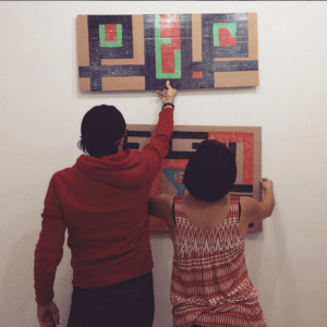 HAYP Pop Up Gallery curator Anna K Gargarian & artist Samvel Saghatelian installing the artworks